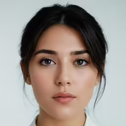 an attractive woman posing for a photograph