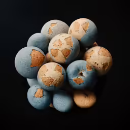 a bowl with some fancy speckled eggs