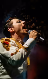 a man with a microphone is singing
