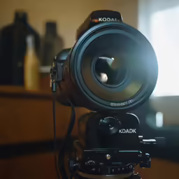 the top of a camera showing its lens