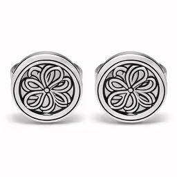 two earrings with flowers are shown in white gold