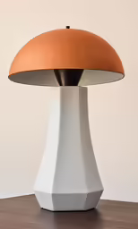 a large table lamp is white with a brown shade