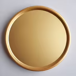 a mirror on the wall with a white background