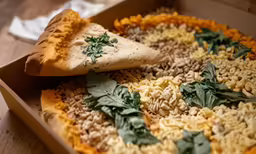 a close up of a pizza pie in a box