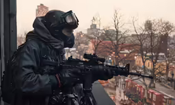 a man wearing a mask with a gun