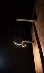 a long black ceiling that is suspended from a hook