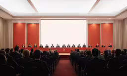 a group of people on stage at a presentation