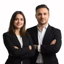 two people posing for a photo while standing next to each other