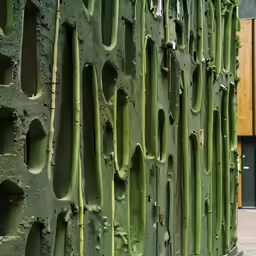 the vertical panels are made of concrete and have unique shapes