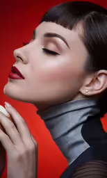 a woman is posing for a portrait and holding onto a small cream