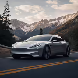 silver sports car driving down a mountainous road