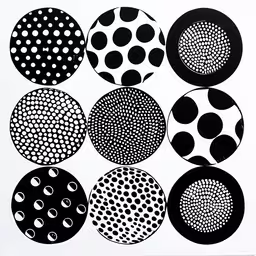 nine circles of different sizes in black and white,a bunch of different circles with different shapes on them