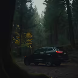 a suv is parked at the top of a path
