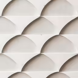 a white wall with circles of small shapes on it