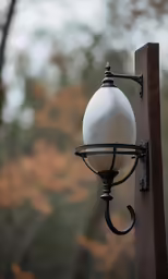 an old fashioned street light hanging on a pole