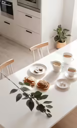 a modern kitchen is furnished with a breakfast table