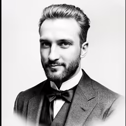 a black and white photograph of a man with a beard