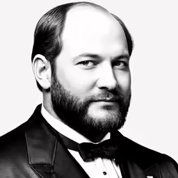 a man with a beard and bow tie