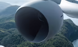 the back side of a propeller flying in the sky