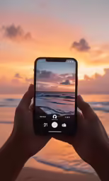someone is taking a photo of an sunset by the beach
