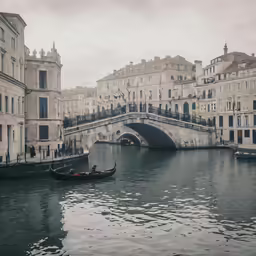 people on boats in a canal during the day