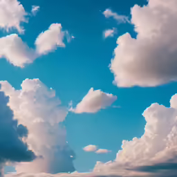 a sky that has lots of white clouds in it