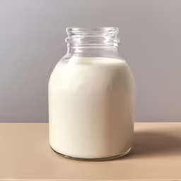 a bottle of cream sitting on a table