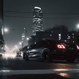 a black sports car is parked on the street at night