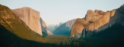 a valley view of some rocks and a large mountain