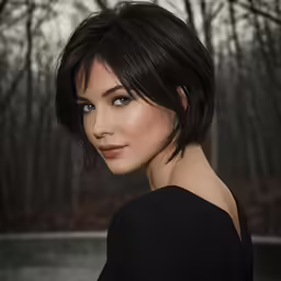 a girl wearing a black shirt standing in front of trees