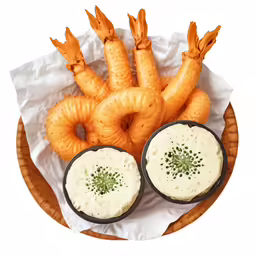 carrot rings, bread ring, onion dip and dipper in bowls