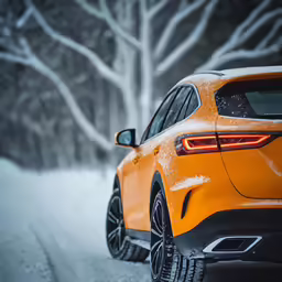 a yellow car parked on the side of a snowy road