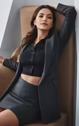 a beautiful woman posing on a chair