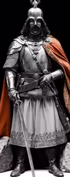 a statue in armor and cape with a sword