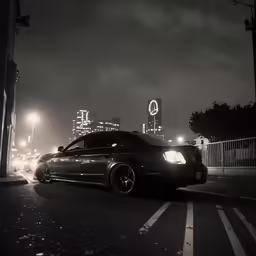 a car on the side of the street at night