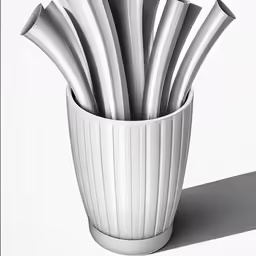 a white cup has silver forks in it