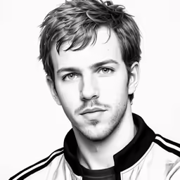 a young man wearing a black and white jacket
