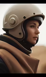 a girl with a helmet on a horse