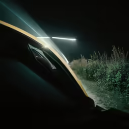 light on street light seen from the back seat of a car