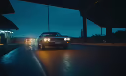 the headlights of a white classic car on a city street
