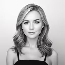 a woman with blond hair and a black tank top
