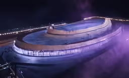 a night scene shows smoke coming from below