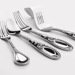 the table is set with silverware and forks