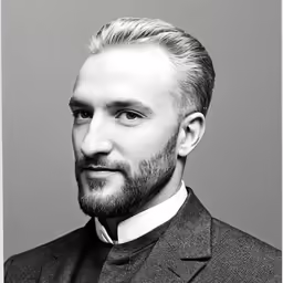 the young man with long hair is wearing a suit