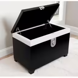 black box with white top and lid for a musical instrument