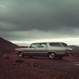 a car parked on a rocky road with a sky background