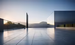 an empty outdoor area with several glass walls