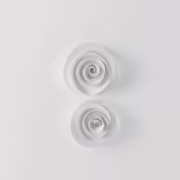 a pair of round white wall light fixtures