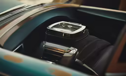 a smart phone on top of a vehicle dashboard
