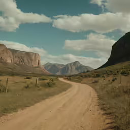 there is a dirt road going to mountains